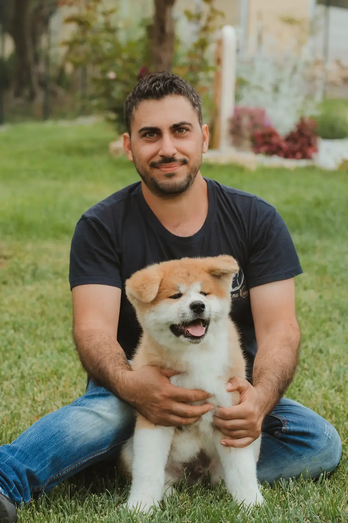 Daniele con un cucciolo di Akita